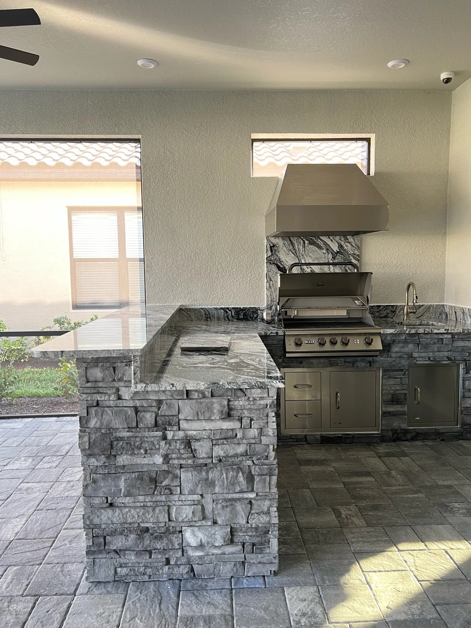 Custom outdoor kitchen with built-in grill on a lanai in Bradenton, FL